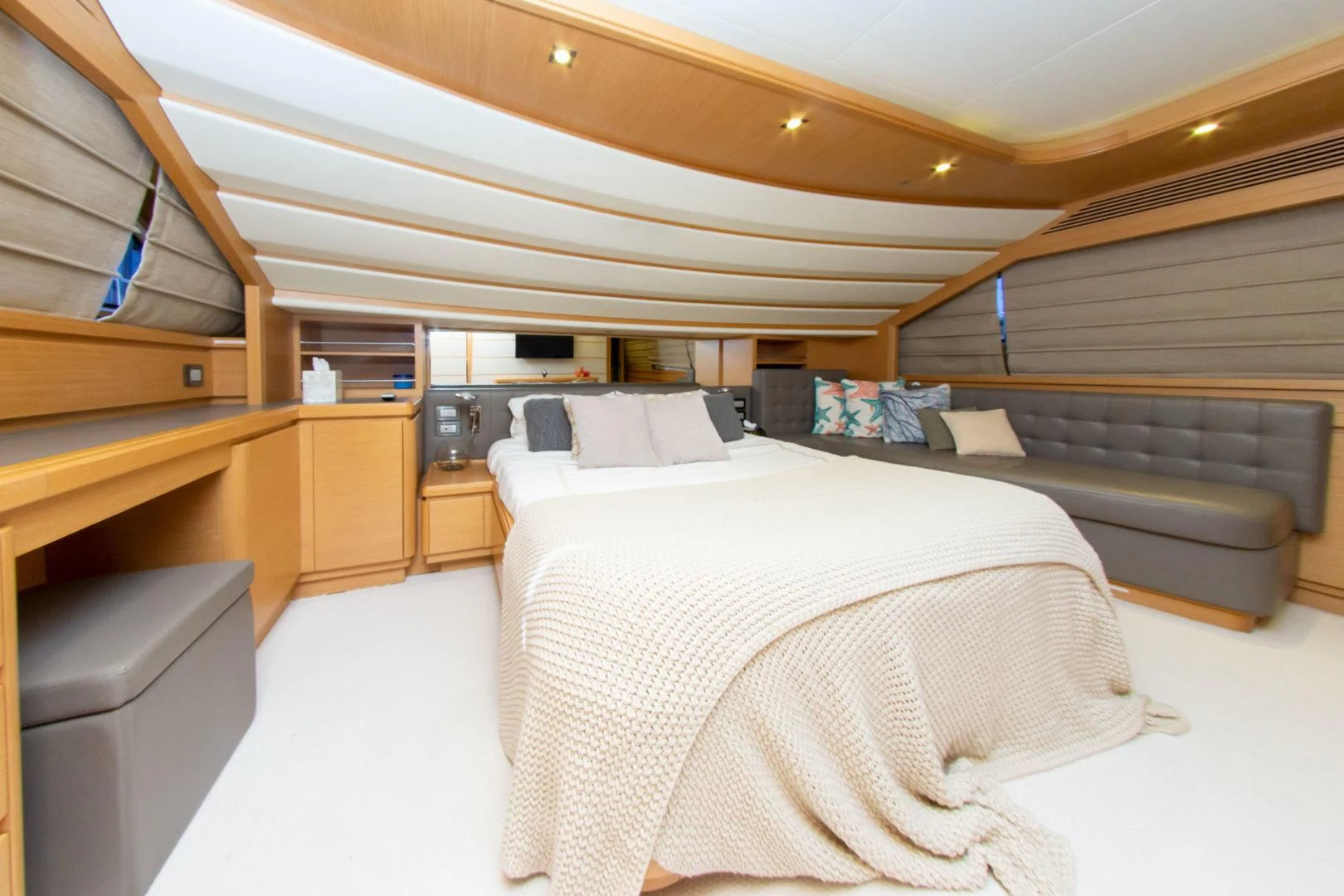 a room with a bed and a couch aboard ADAR Yacht for Sale