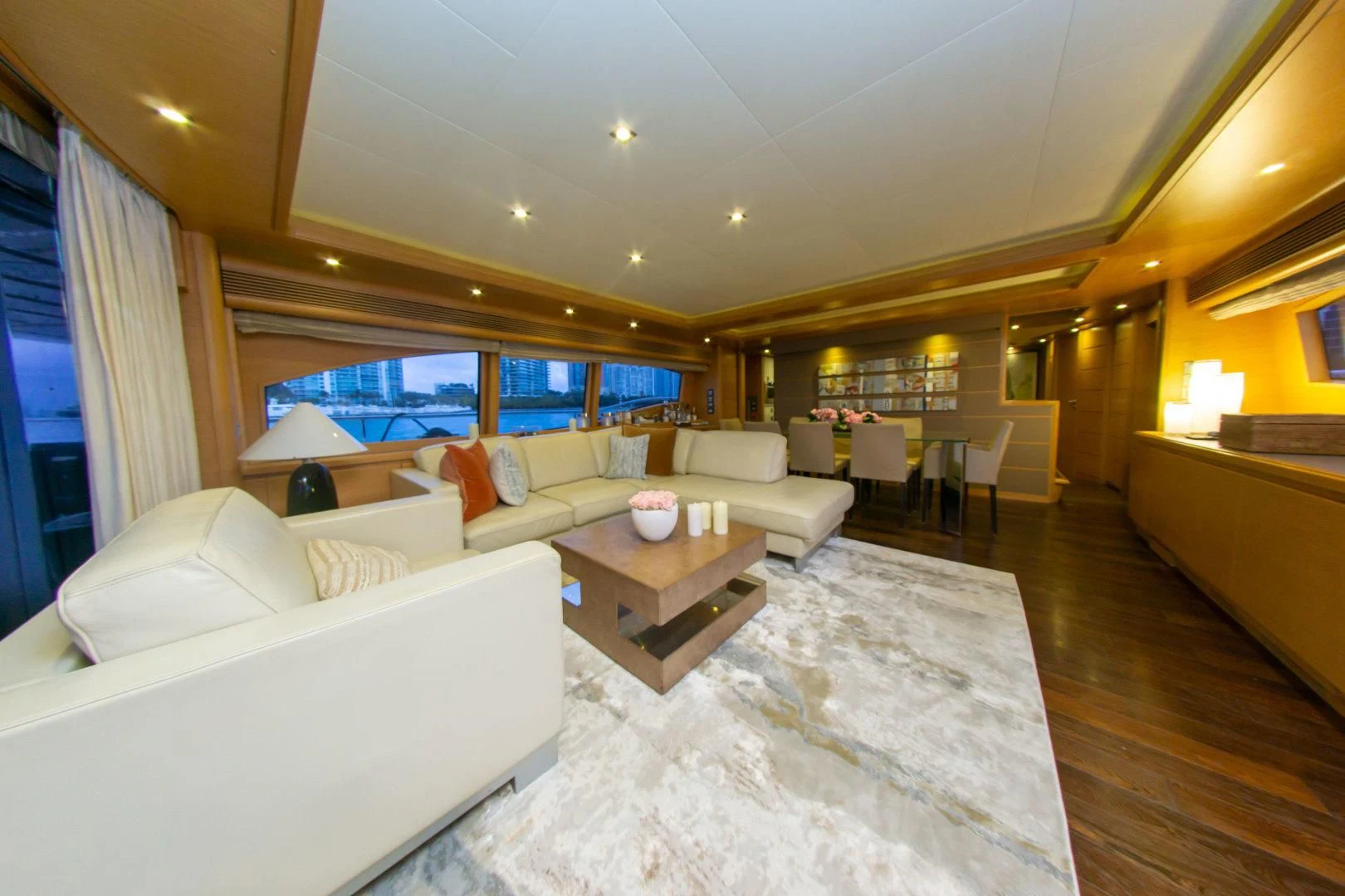 a living room with a large window aboard ADAR Yacht for Sale