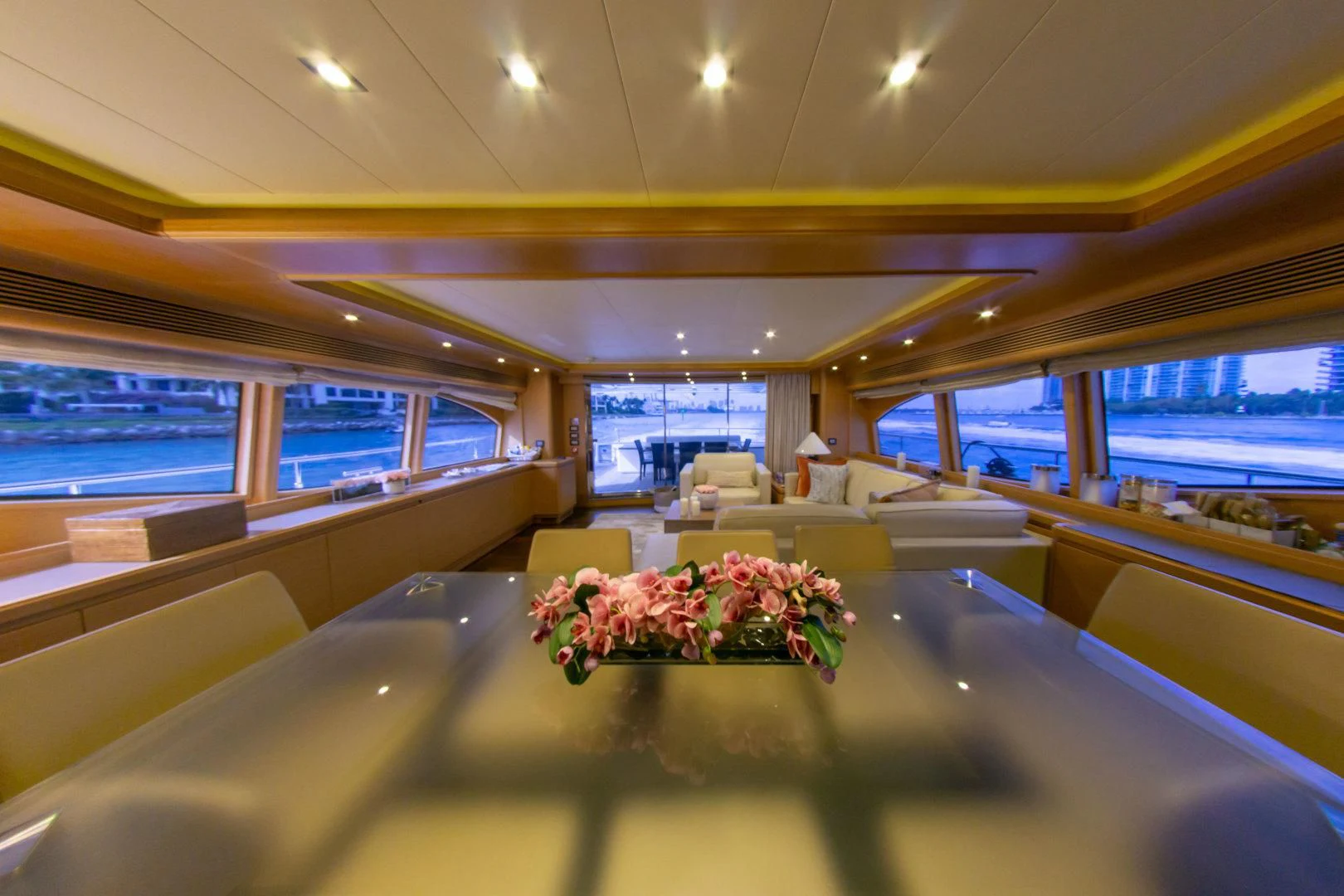 a room with a table and chairs aboard ADAR Yacht for Sale