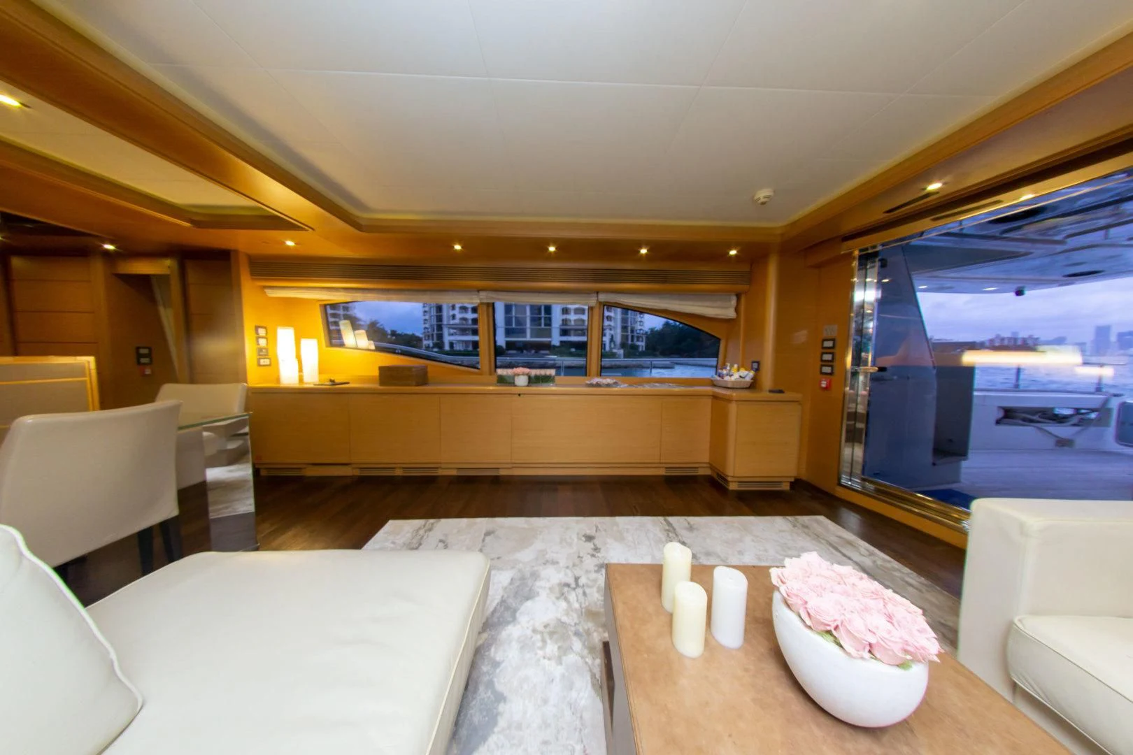 a room with a table and chairs aboard ADAR Yacht for Sale
