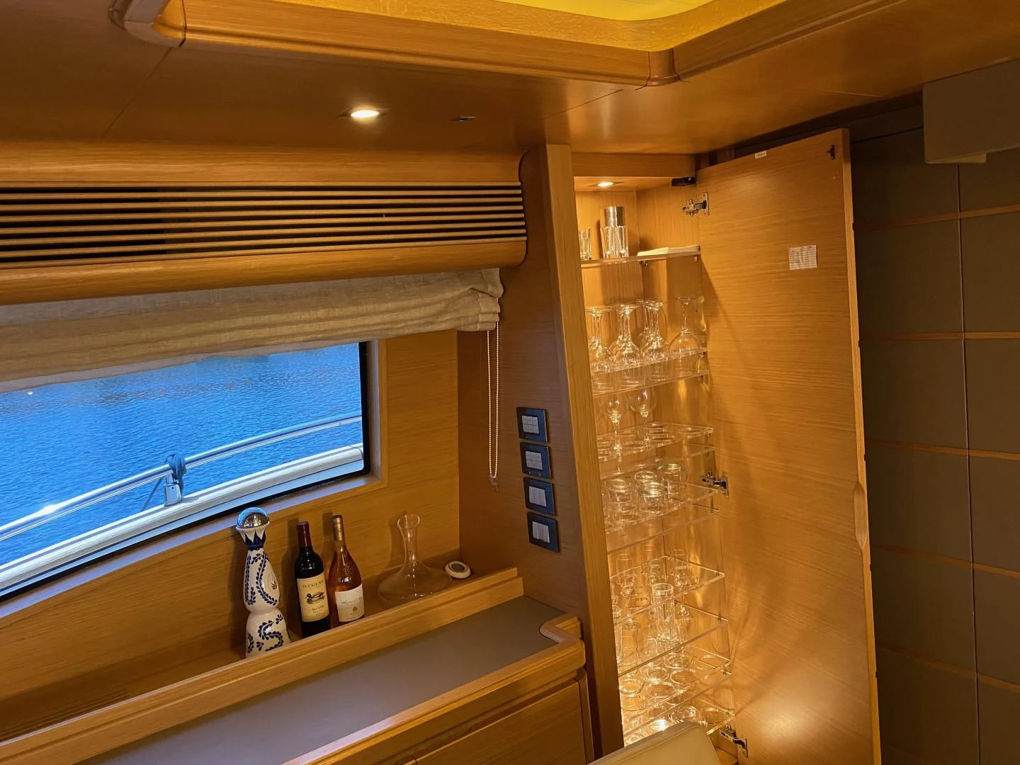 a wine glass on a counter aboard ADAR Yacht for Sale