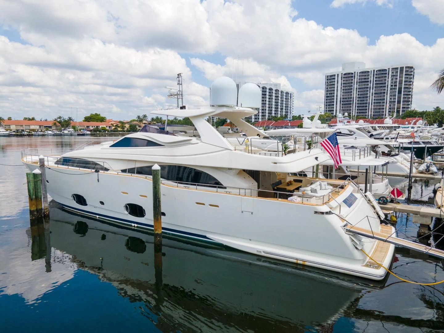 a boat docked at a pier aboard ADAR Yacht for Sale