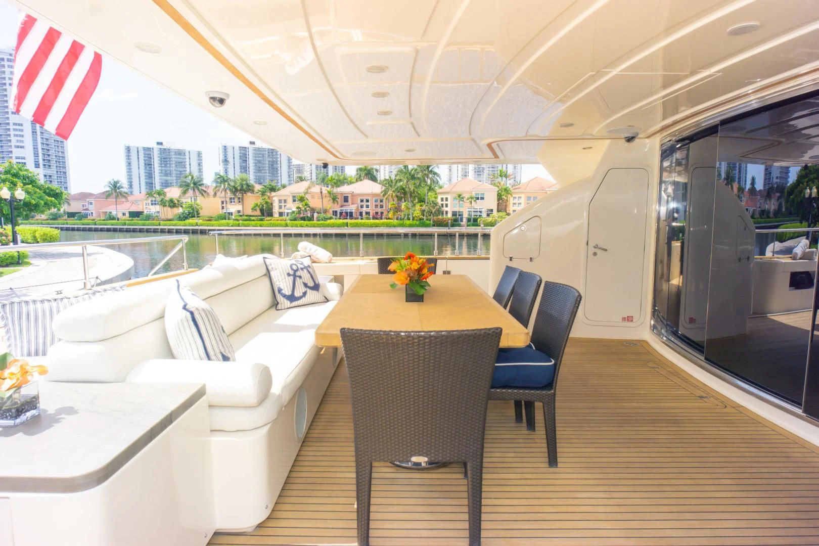 a room with a table chairs and a couch aboard ADAR Yacht for Sale