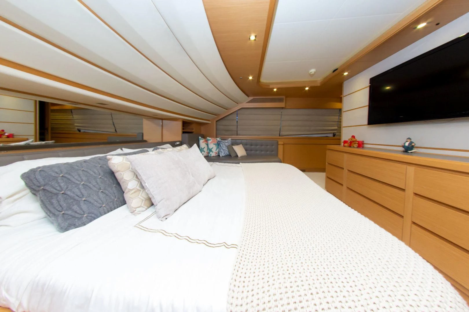 a room with a bed and a tv aboard ADAR Yacht for Sale