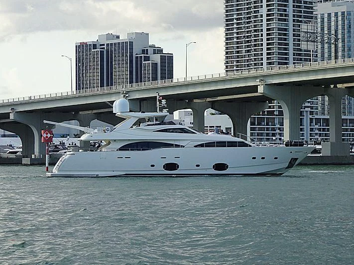 a white boat in the water aboard ADAR Yacht for Sale
