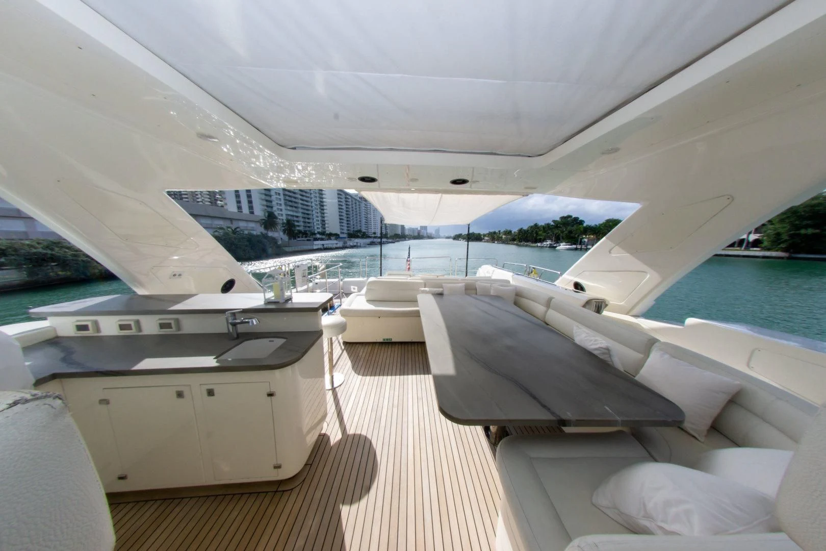 a room with a view of a city and a body of water aboard ADAR Yacht for Sale