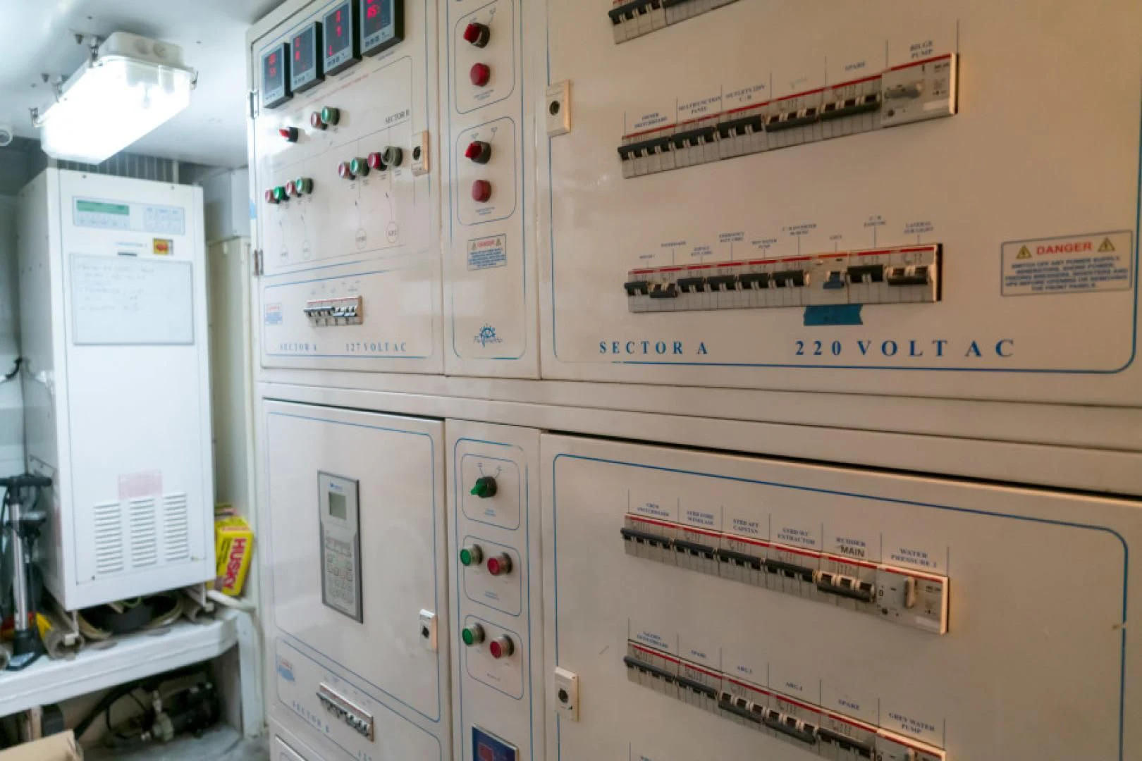 a white machine with red buttons aboard ADAR Yacht for Sale