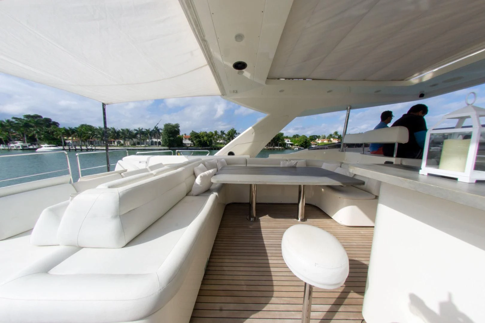 a room with a pool and a couple of people sitting on a bench aboard ADAR Yacht for Sale