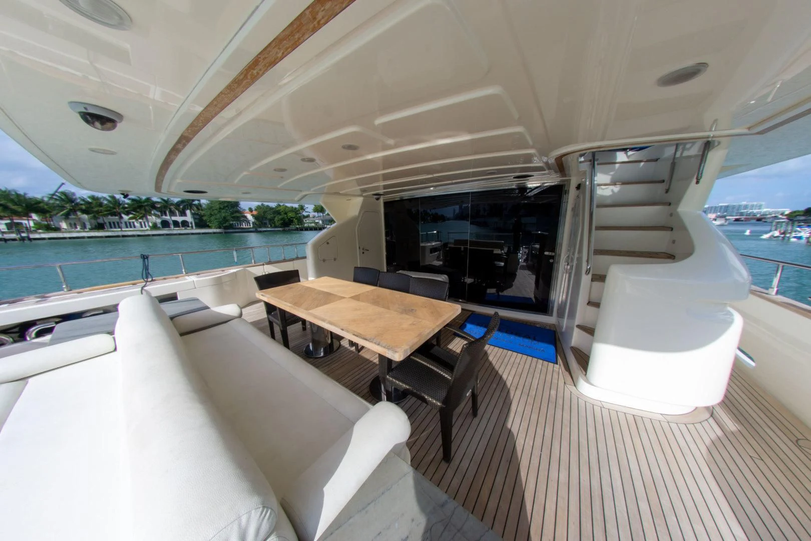 a room with a table chairs and a pool aboard ADAR Yacht for Sale
