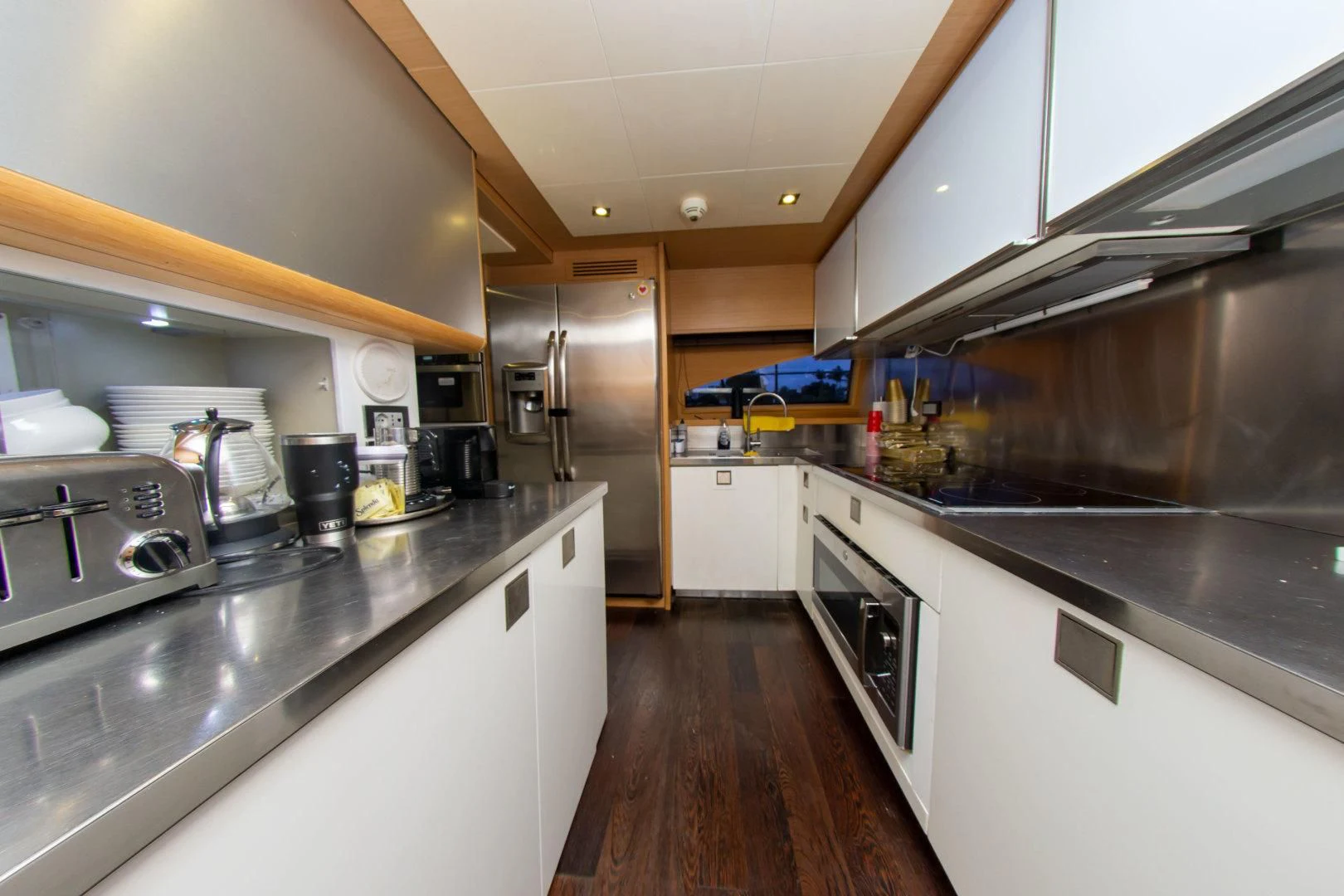 a kitchen with stainless steel appliances aboard ADAR Yacht for Sale