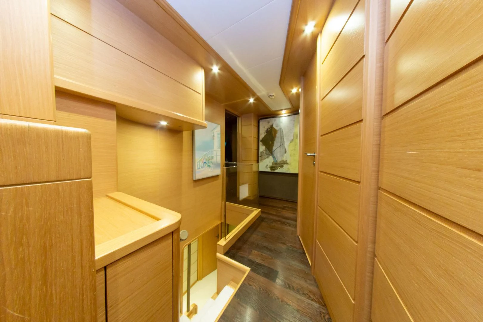 a room with wooden cabinets aboard ADAR Yacht for Sale