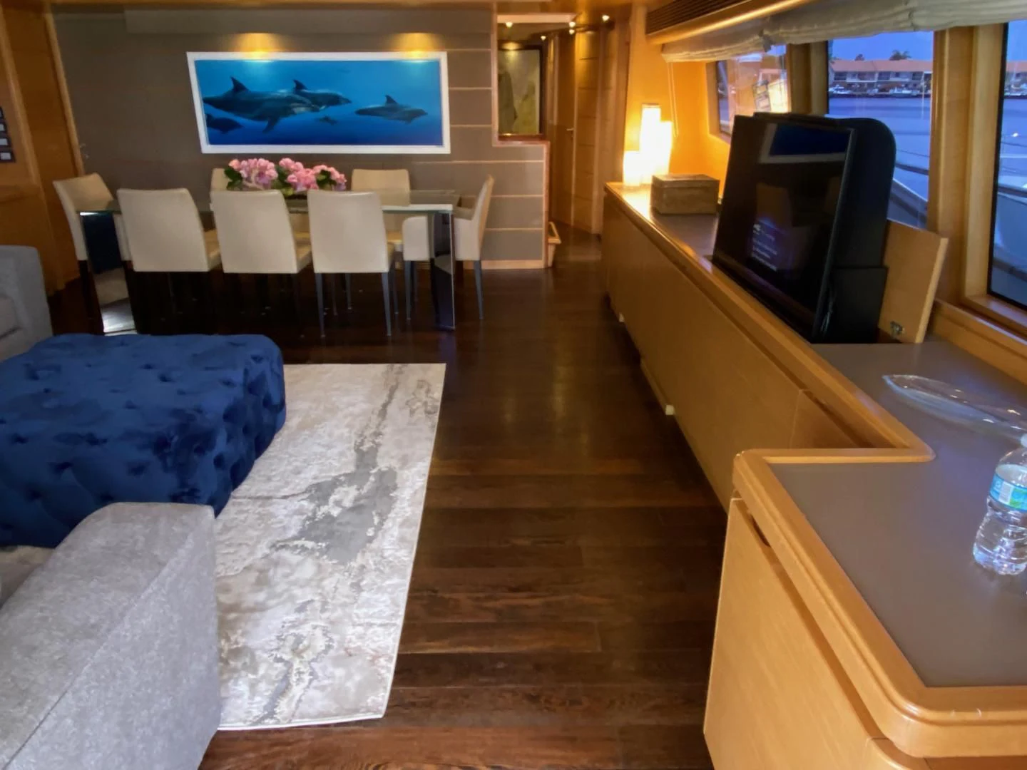 a room with a couch and a television aboard ADAR Yacht for Sale