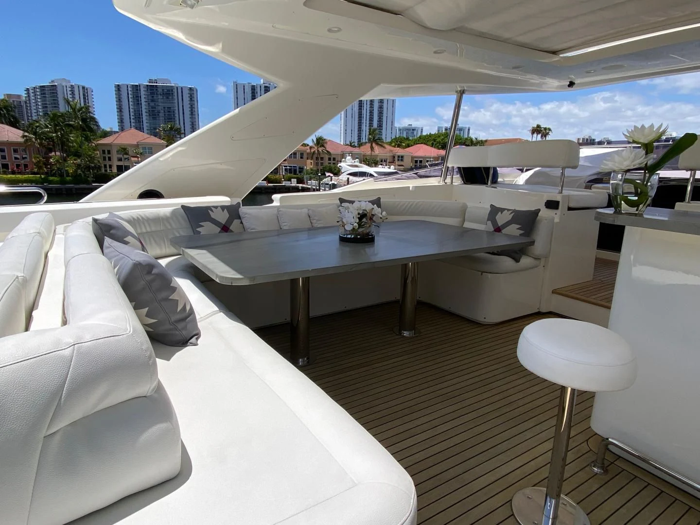 a room with a table and chairs aboard ADAR Yacht for Sale