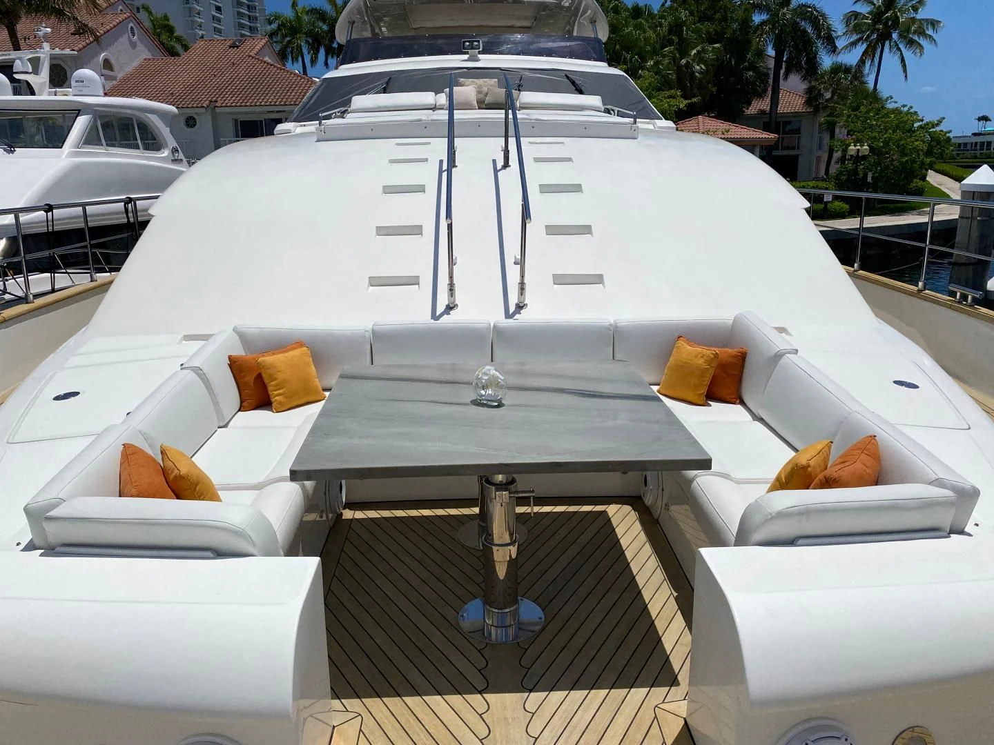a white boat with a white roof aboard ADAR Yacht for Sale