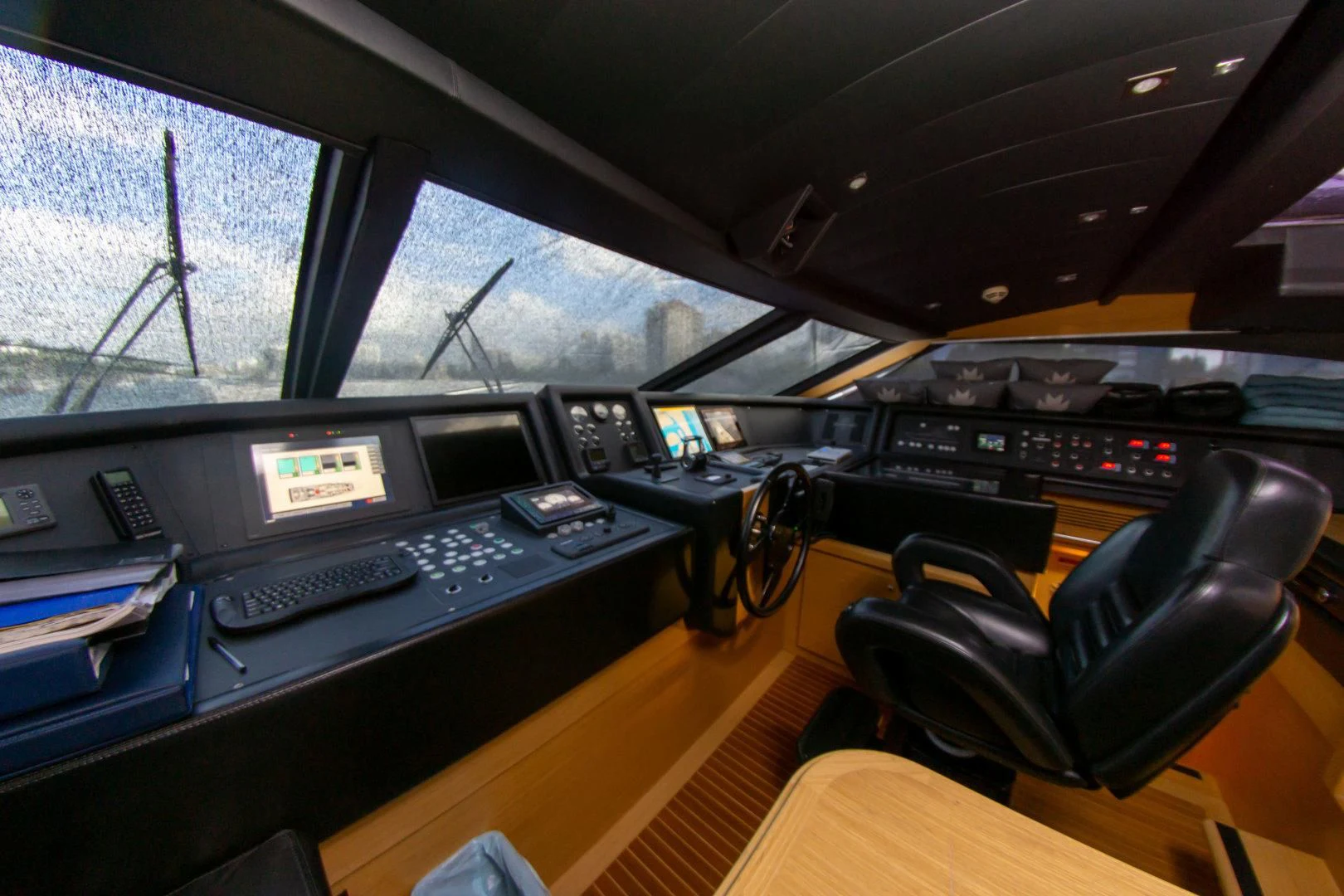 a cockpit with a desk and computer aboard ADAR Yacht for Sale