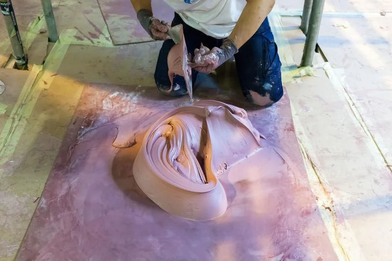 a person working on a clay pot aboard MASA Yacht for Sale
