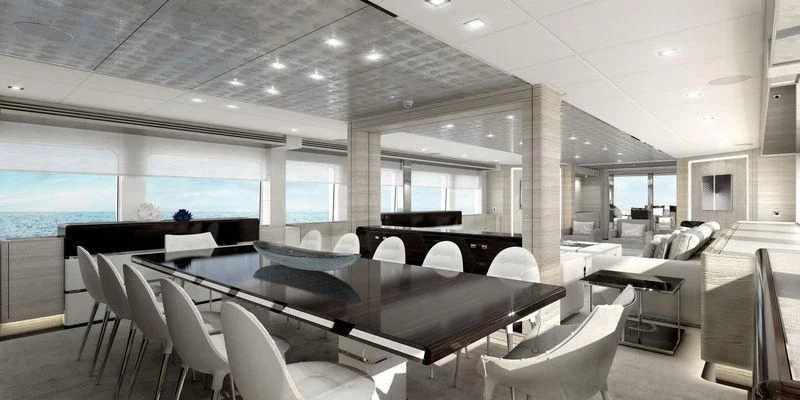 a room with tables and chairs aboard MASA Yacht for Sale