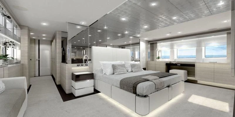 a large white bedroom with a large bed and a large mirror aboard MASA Yacht for Sale