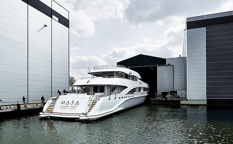 a boat docked at a pier aboard MASA Yacht for Sale