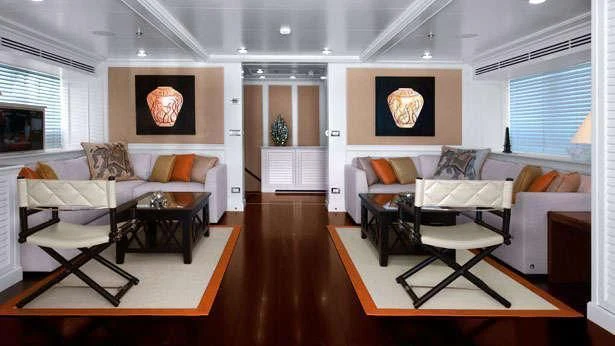 a living room with a large mirror aboard LIBRA OMEGA Yacht for Sale