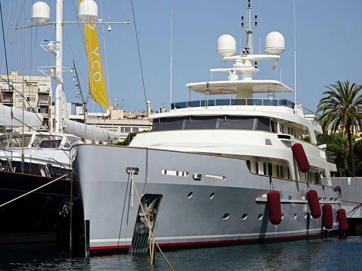 a large white boat sits in the water aboard LIBRA OMEGA Yacht for Sale