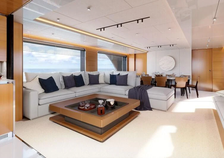 a living room with a couch and a table aboard A SALT WEAPON Yacht for Charter