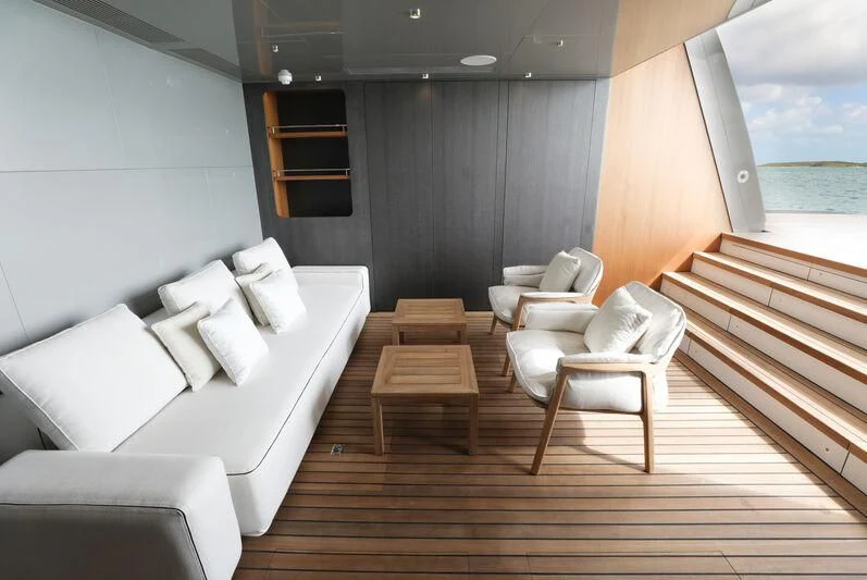 a room with a bed and a table aboard A SALT WEAPON Yacht for Charter