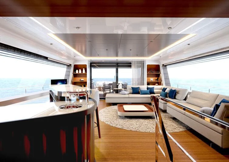 a living room with a large window aboard A SALT WEAPON Yacht for Charter