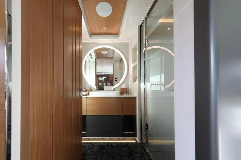 a bathroom with a large mirror aboard A SALT WEAPON Yacht for Charter