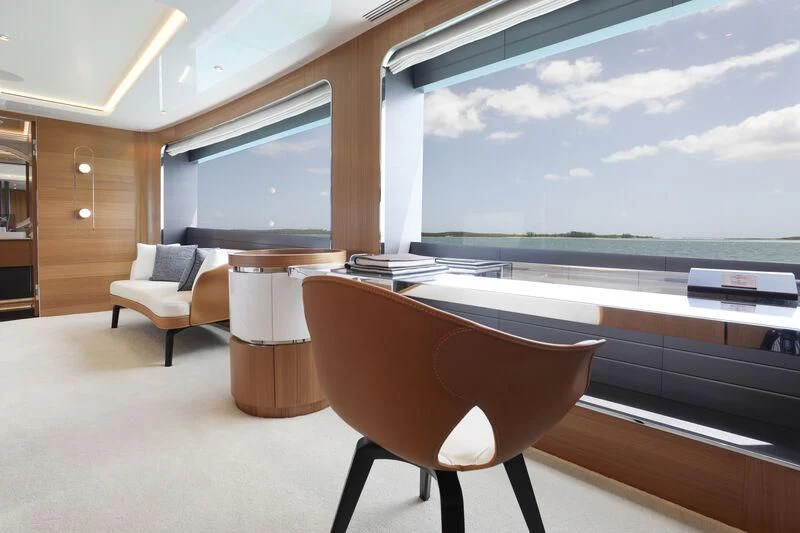 a room with a table and chairs aboard A SALT WEAPON Yacht for Charter