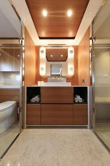 a bathroom with a toilet and a sink aboard A SALT WEAPON Yacht for Charter
