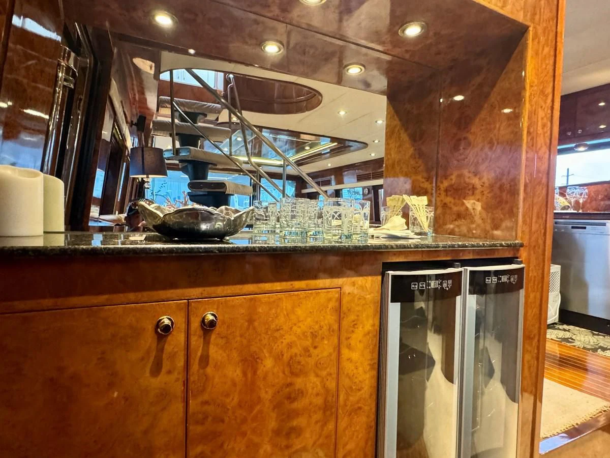 a kitchen with a glass display aboard DREAMCHASER Yacht for Sale