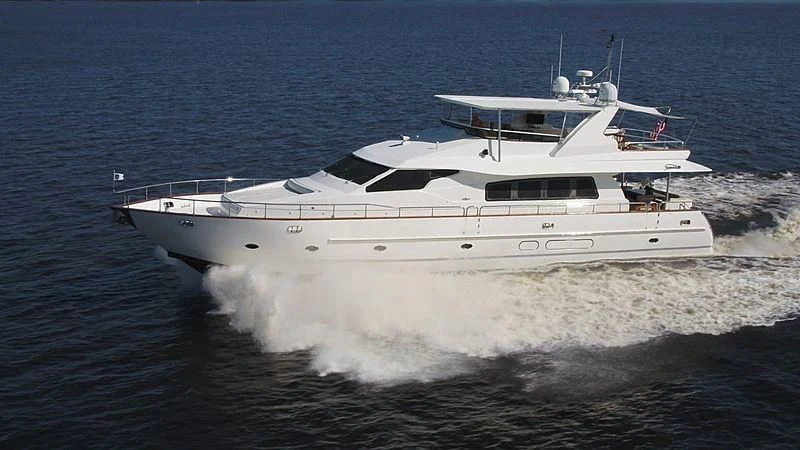 a white yacht on the water aboard DREAMCHASER Yacht for Sale