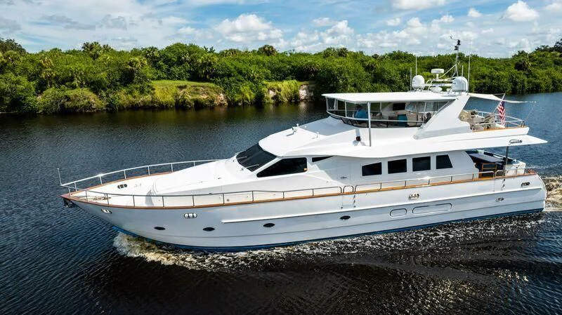 a couple of boats on a beach aboard DREAMCHASER Yacht for Sale