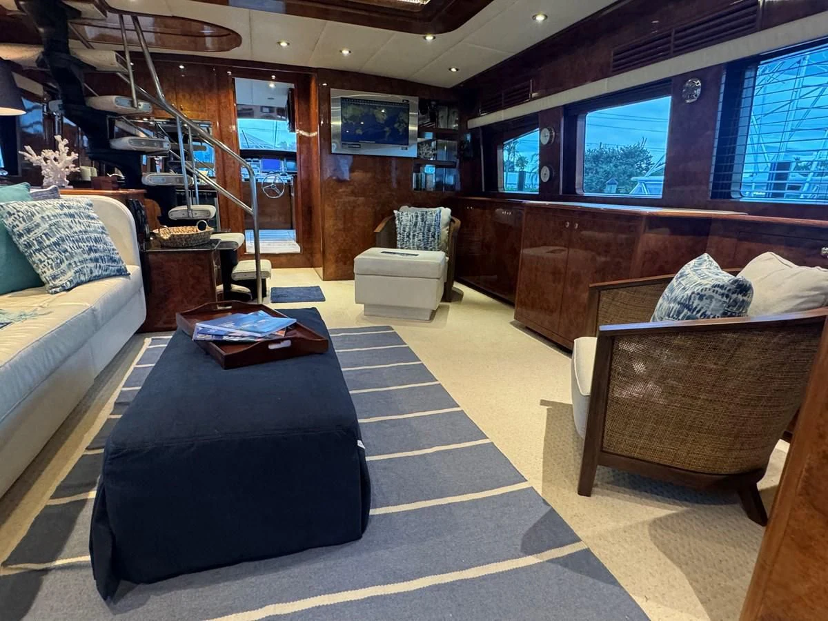 a room with a bed and a couch aboard DREAMCHASER Yacht for Sale