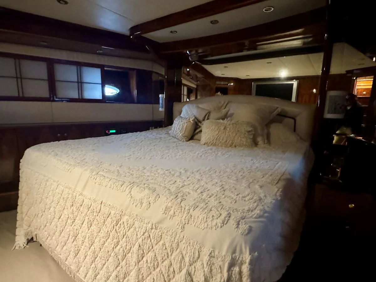 a couple of sheep lay on a bed aboard DREAMCHASER Yacht for Sale