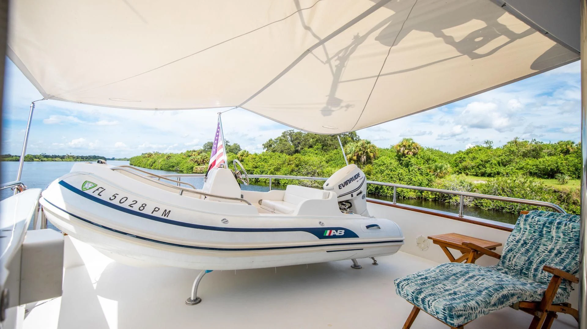 a couple of boats on a deck aboard DREAMCHASER Yacht for Sale