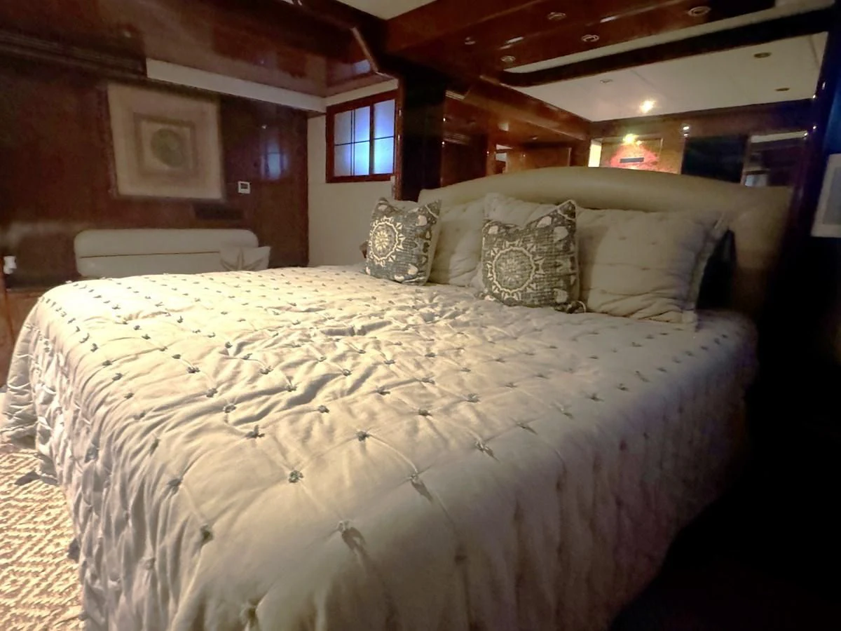 a bed with pillows aboard DREAMCHASER Yacht for Sale