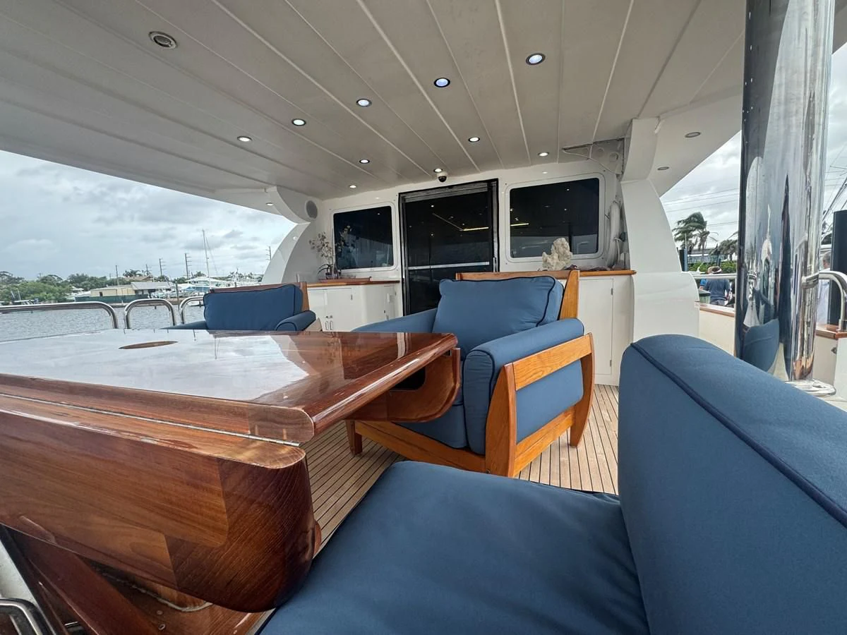 a boat with a wood deck aboard DREAMCHASER Yacht for Sale