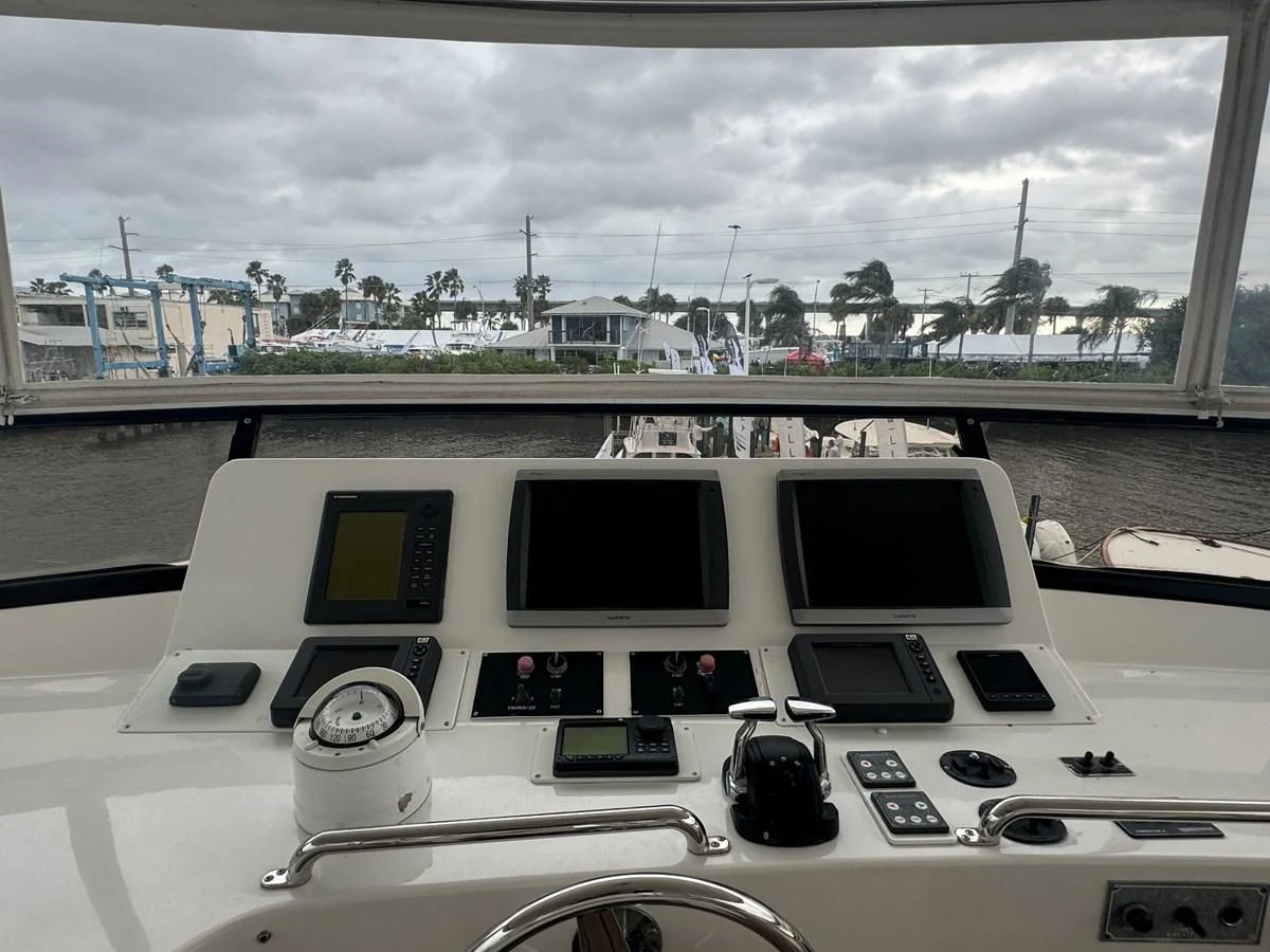 a group of computers on a table aboard DREAMCHASER Yacht for Sale