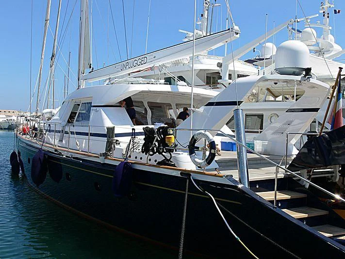 a boat docked at a pier aboard UNPLUGGED Yacht for Sale