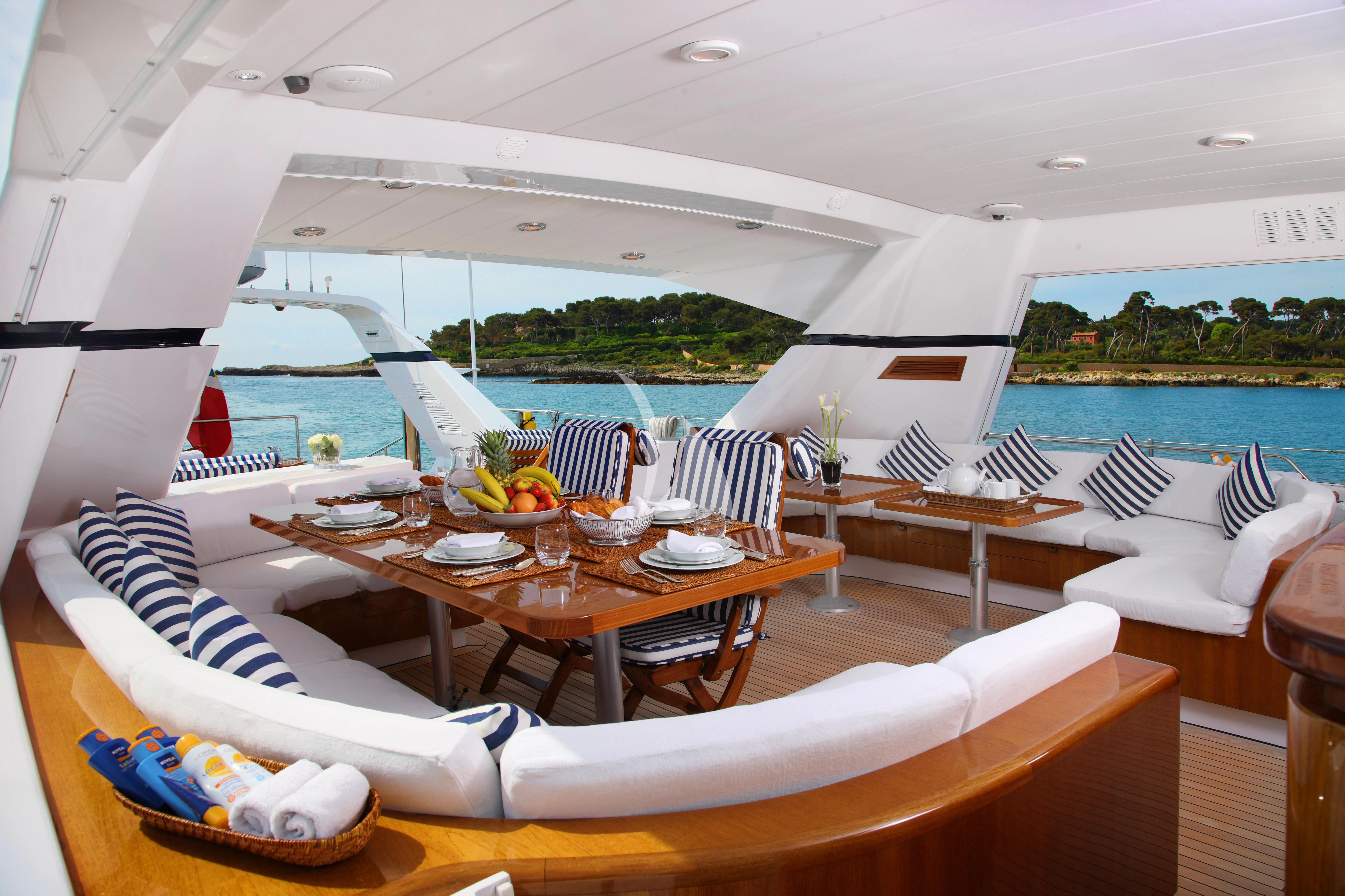 a table set for a meal on a boat aboard UNPLUGGED Yacht for Sale
