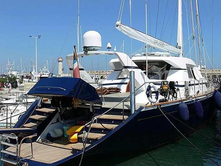 a boat docked at a pier aboard UNPLUGGED Yacht for Sale