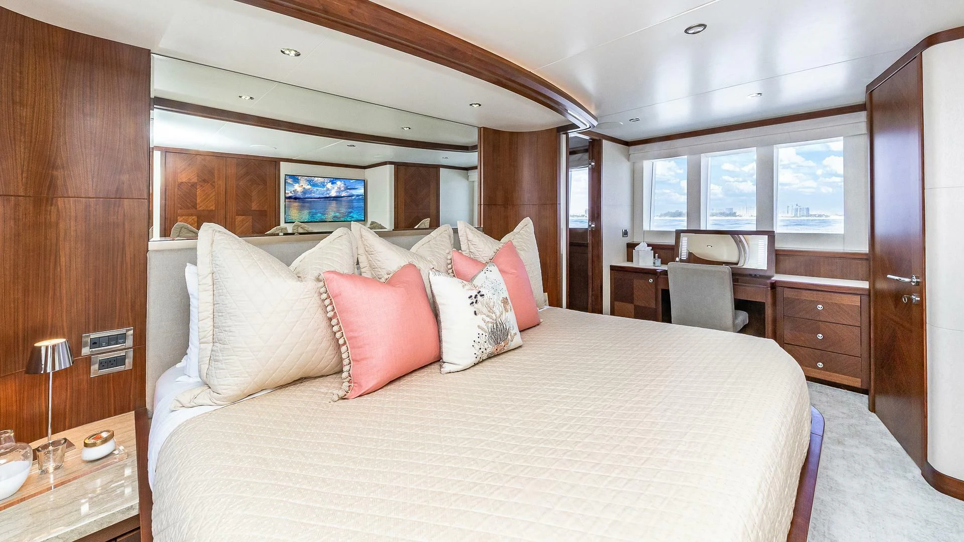 a bed with pillows on it aboard BRAVO ZULU II Yacht for Sale