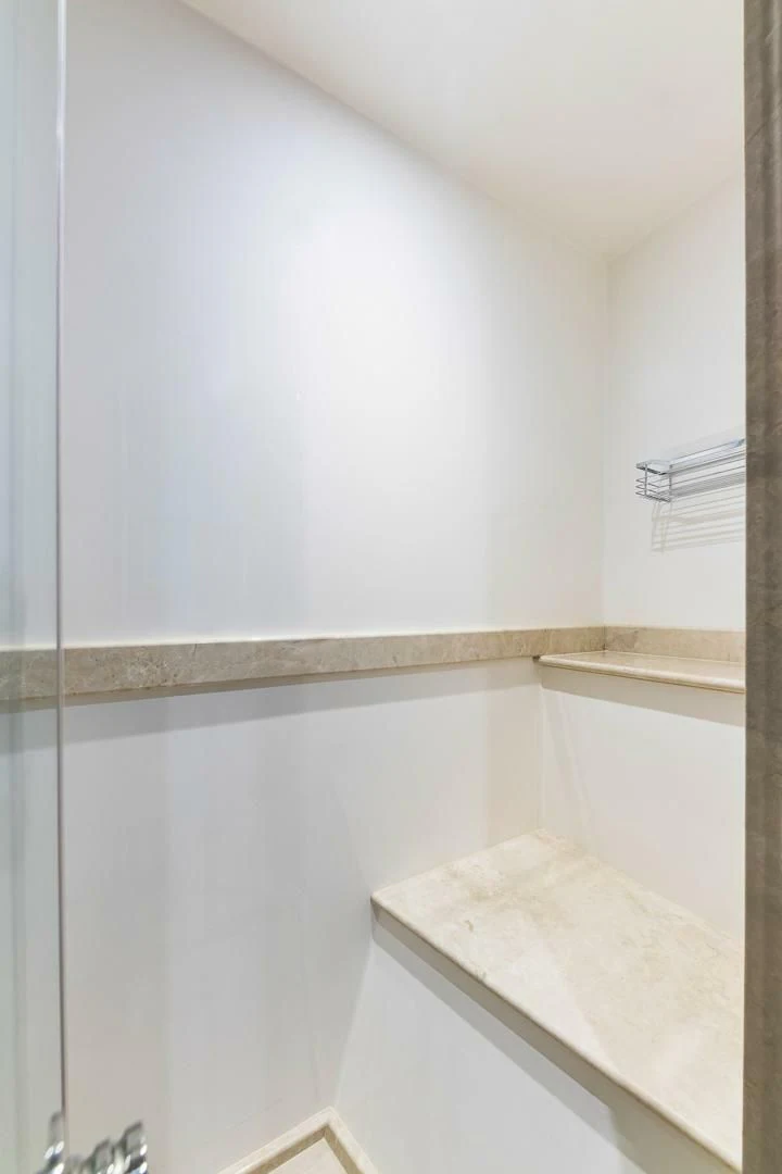 a white wall with a shelf aboard BRAVO ZULU II Yacht for Sale