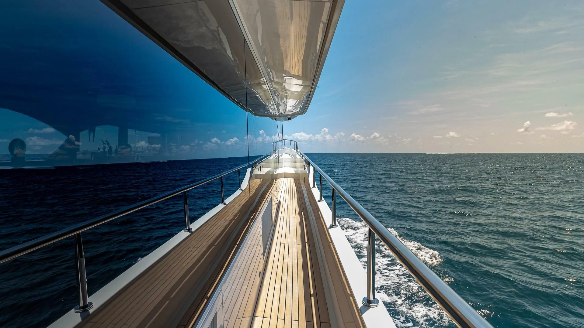 a long wooden boat on the water aboard BRAVO ZULU II Yacht for Sale
