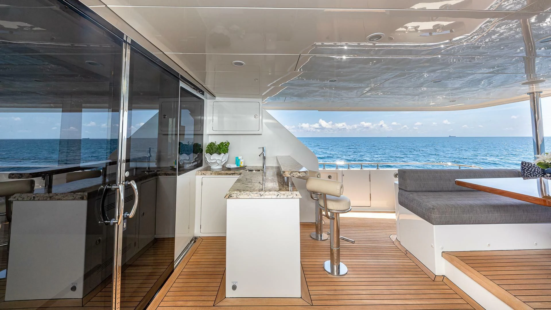 a modern looking room with a large glass window aboard BRAVO ZULU II Yacht for Sale