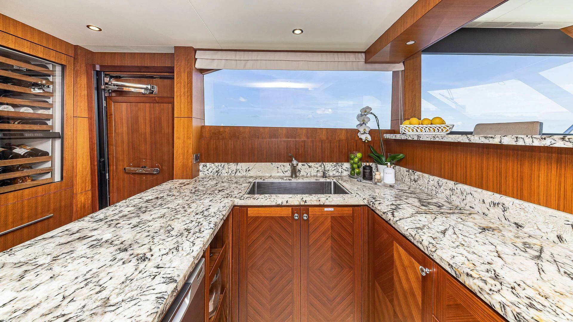 a kitchen with marble counters aboard BRAVO ZULU II Yacht for Sale