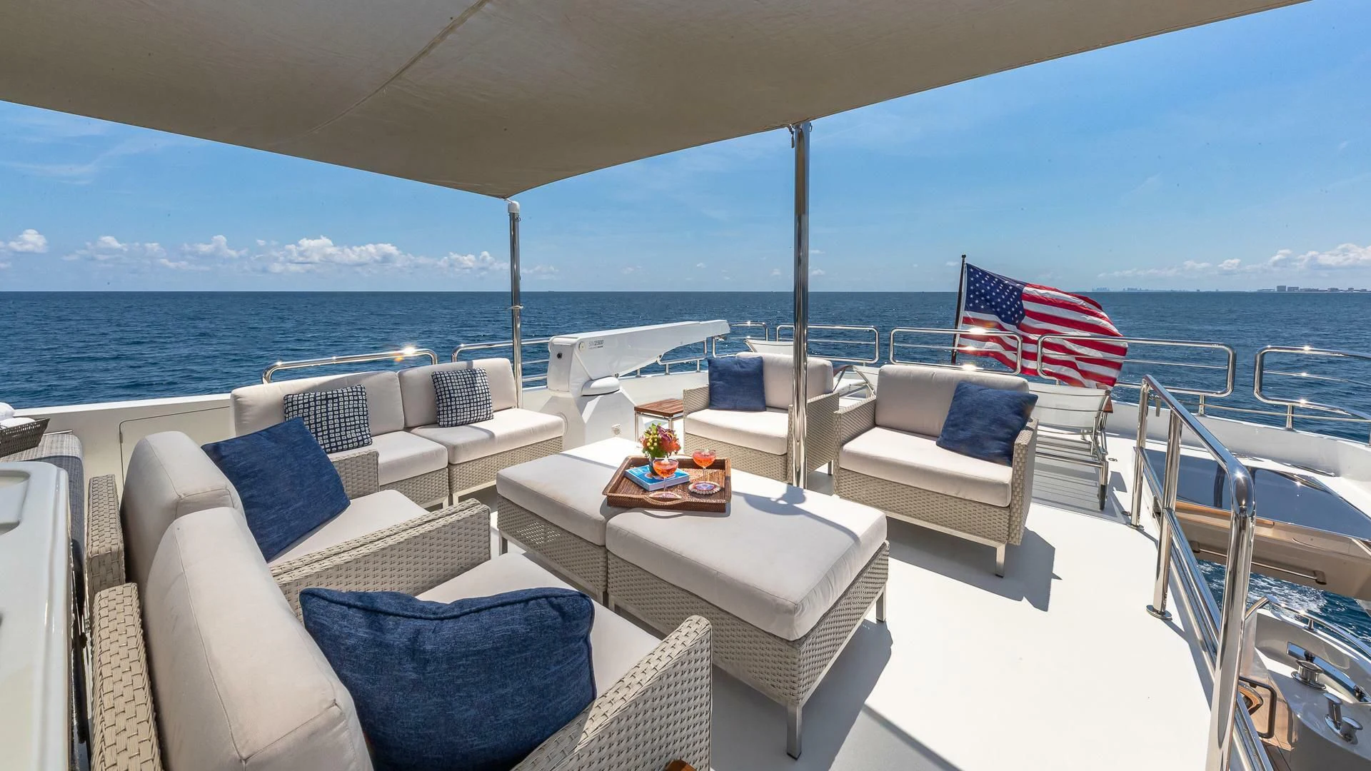 a large white tent with a table and chairs on it aboard BRAVO ZULU II Yacht for Sale