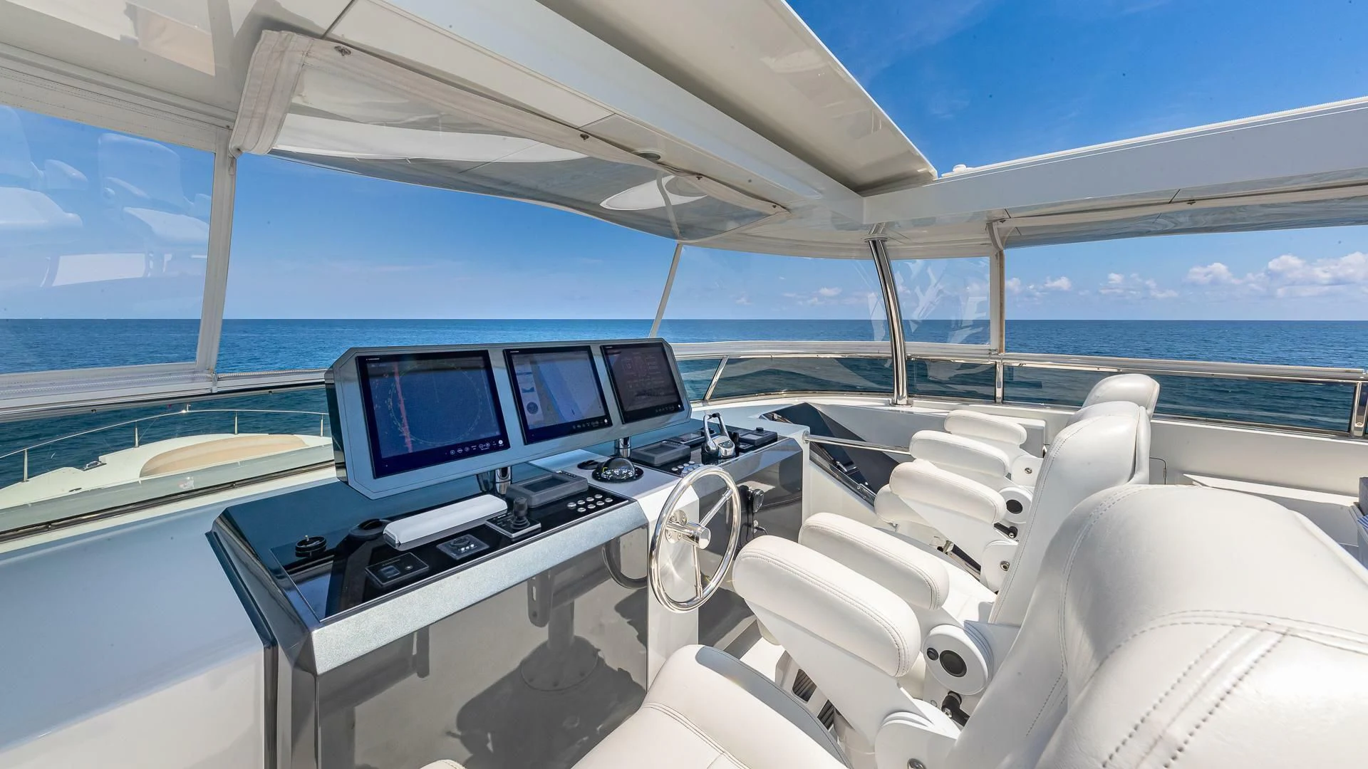 a large white yacht with many computers aboard BRAVO ZULU II Yacht for Sale
